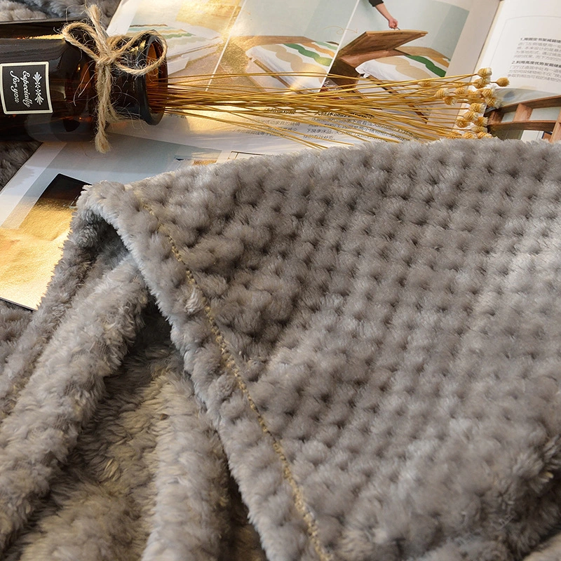 Super Soft and Breathable Coral Fleece Blanket with Honeycomb Design.